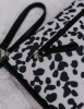 Picture of OIOI CHANGE MAT CLUTCH DALMATION, BLACK TRIM